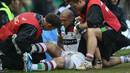 Harlequins' Mike Brown receives some attention