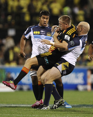 Gareth Anscombe of the Chiefs is manhandled against the Brumbies, Brumbies v Chiefs, Super Rugby, Canberra Stadium, April 25, 2014