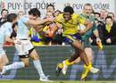Clermont Auvergne winger Napolioni Nalaga fends off the Bayonne defence