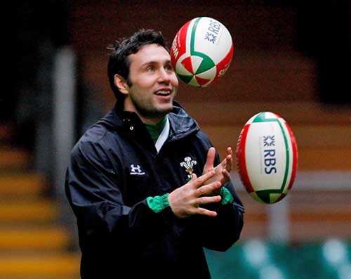 Wales fly-half Stephen Jones juggles the ball during a training session