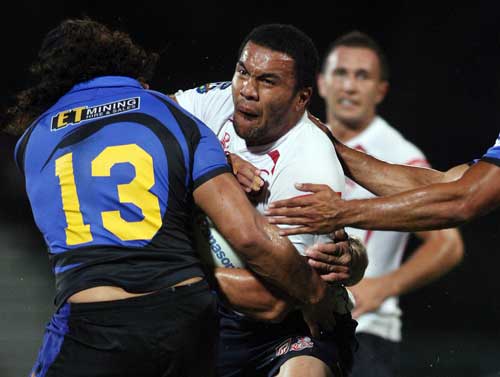 The Reds' Digby Ioane is tackled by the Western Force defence