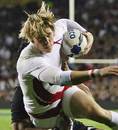 England's David Strettle is tackled by New Zealand's Jerome Kaino