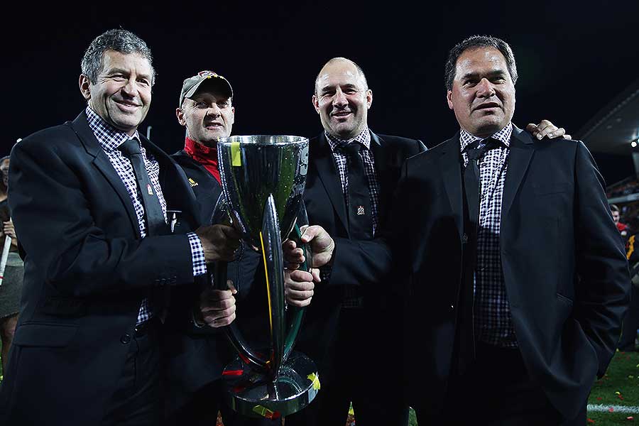 Chiefs coaches Wayne Smith, Andrew Strawbridge, Tom Coventry and Dave Rennie celebrate their second successive Super Rugby final victory