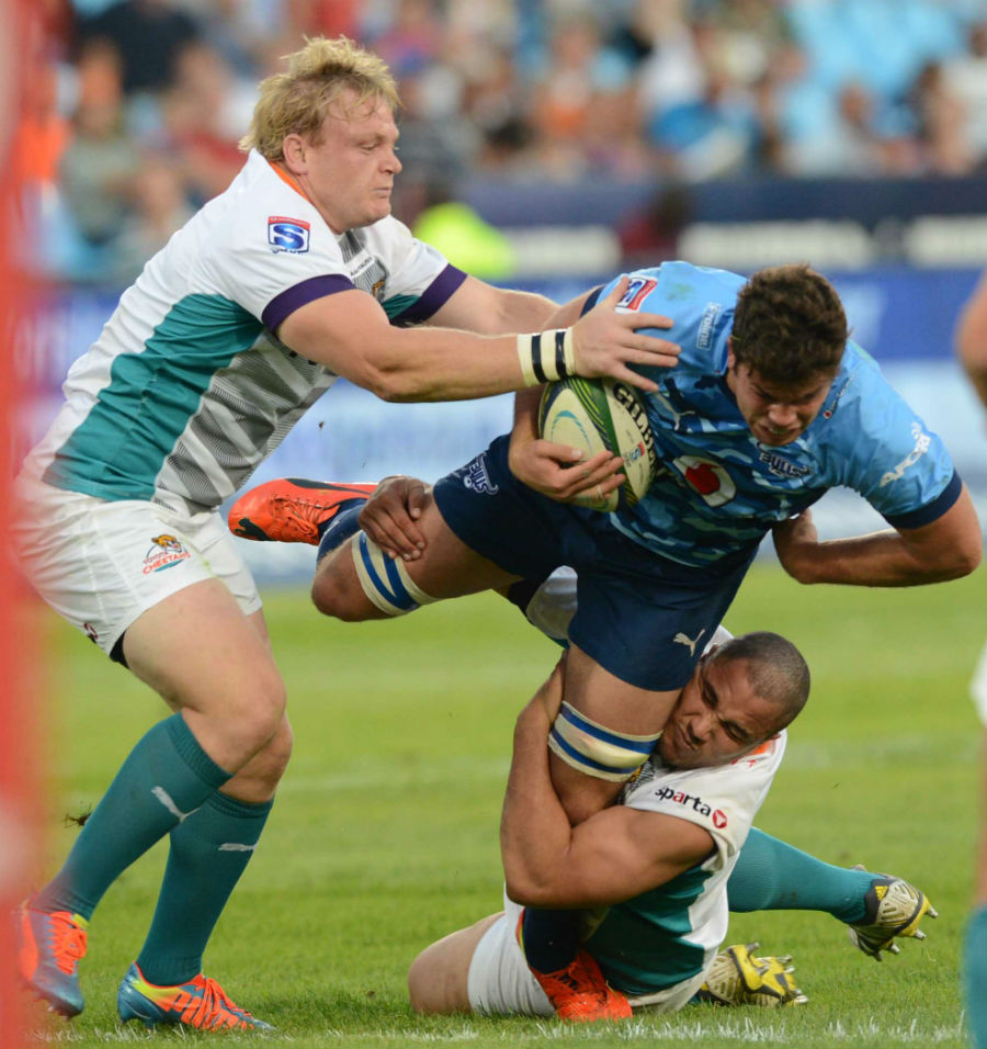 Jono Ross of the Bulls tackled by Andriaan Strauss of the Cheetahs