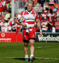 Mike Tindall carries his daughter Mia after what is likely to be his last home game