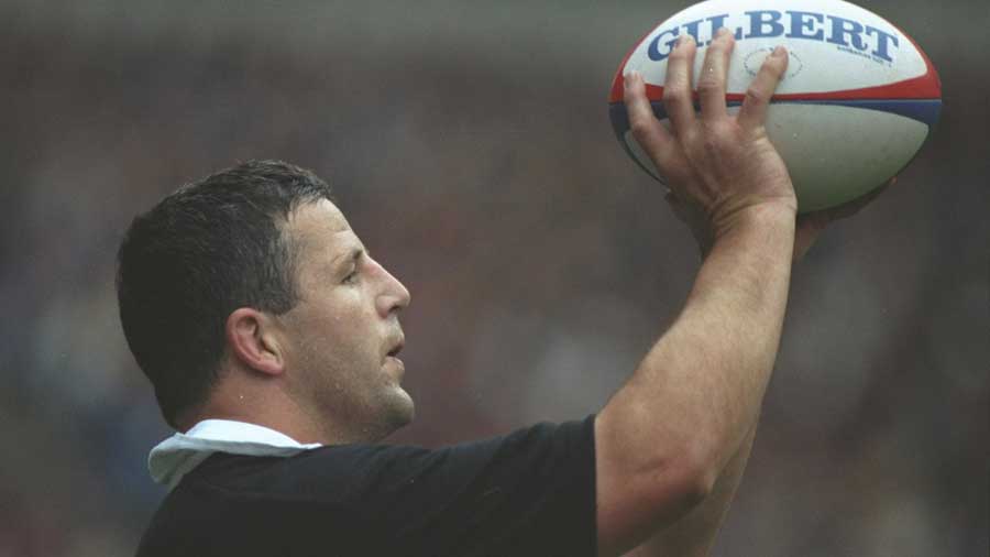 New Zealand's Sean Fitzpatrick throws the ball in