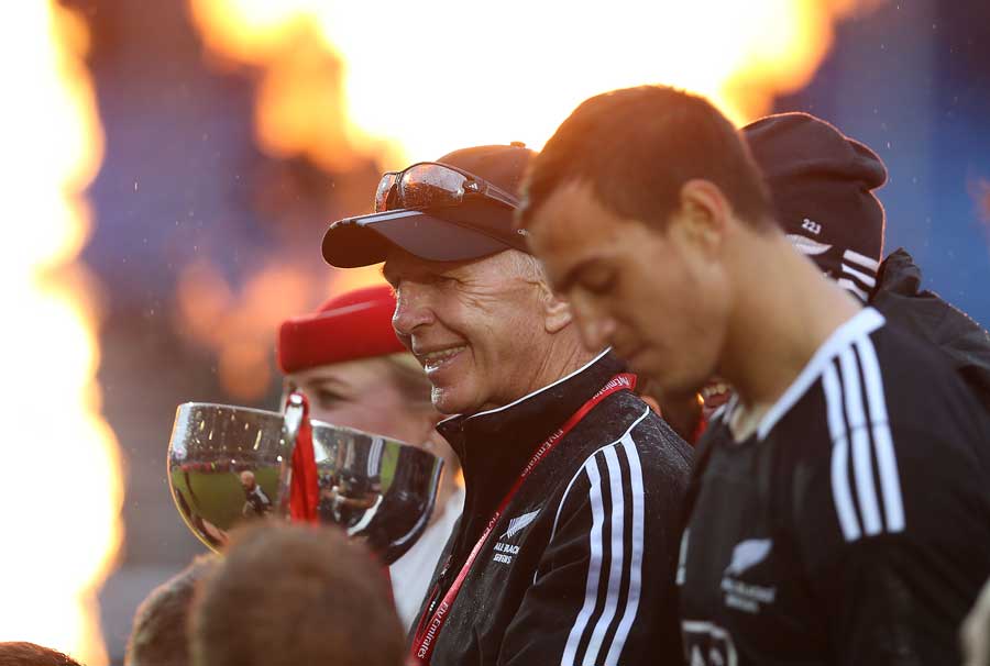 New Zealand coach Gordon Tietjens holds the trophy