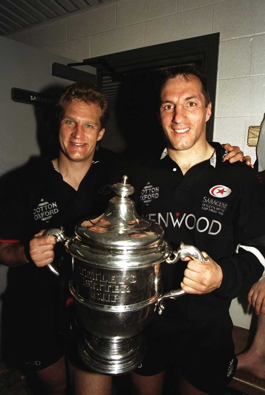 Saracens' Michael Lynagh and Philippe Sella hold the Tetley's Bitter Cup
