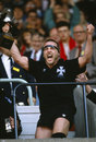 Neath's Kevin Phillips shows his excitement as he celebrates with the trophy