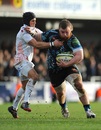 Exeter Chiefs' Lloyd Fairbrother is tackled by Ospreys' Matthew Morgan
