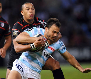 Racing Metro's Juan Martin Hernandez is wrapped up by Gael Fickou, Toulouse v Racing Metro, Top 14 quarter-finals, Stade Stade Ernest Wallon, Toulouse, May 9, 2014