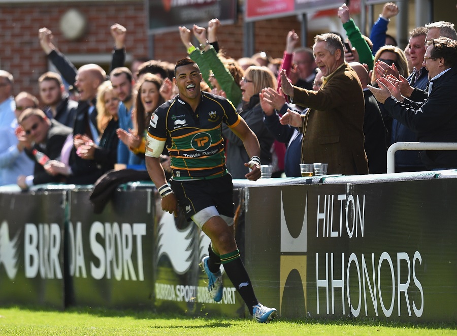 Luther Burrell celebrates scoring a try