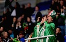 A London Irish fan shows his colours
