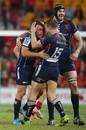 The Rebels' Ben Meehan, Jason Woodward and Hugh Pyle celebrate victory
