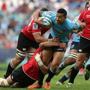 The Waratahs' Israel Folau takes the ball into contact, New South Wales Waratahs v Lions, Super Rugby, Allianz Stadium, Sydney, May 18, 2014