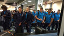 England wait for their luggage at the airport