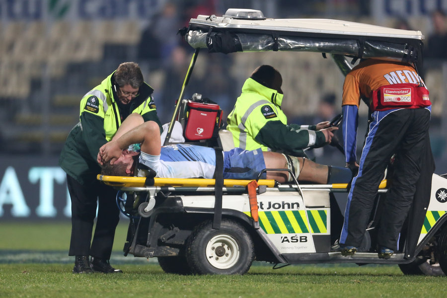 Angus Cottrell of the Western Force is stretchered off after breaking his leg