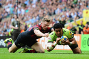 Chris Ashton fails to stop George Pisi as he goes over to score Northampton Saints' second try