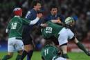 Clement Poitrenaud of France is tackled by Luke Fitzgerald and Brian O'Driscoll of Ireland