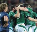 Ireland's No.8 Jamie Heaslip is congratulated by teammates after scoring a try
