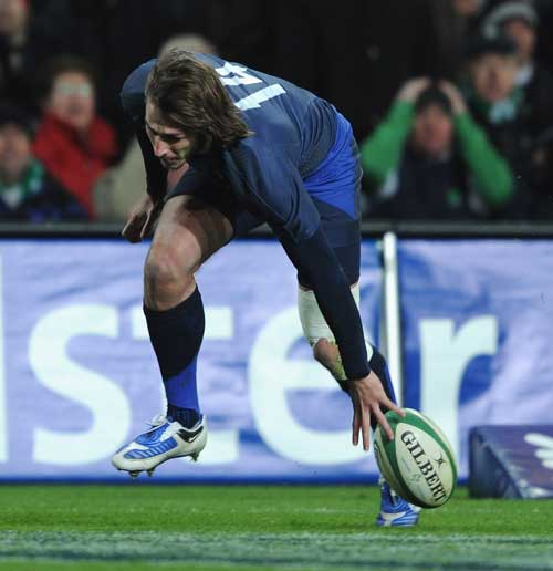 Maxime Medard of France scores a try for France