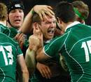 Ireland's Gordon D'Arcy is congratulated by his team mates after scoring a try