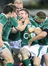 Ireland's Gordon D'Arcy celebrates with his team mates after scoring a try