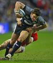 Scotland's Max Evans tries to escape the clutches of Wales' Shane Williams