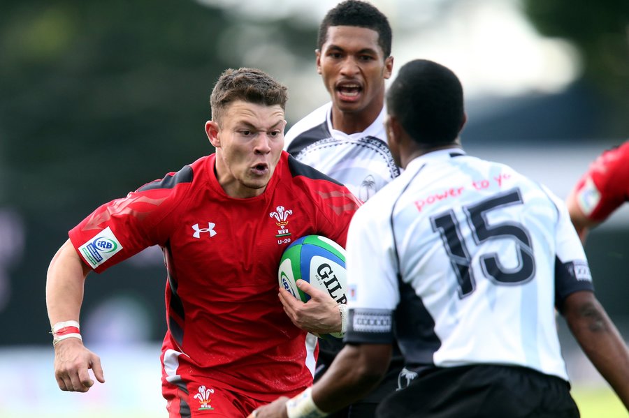 Ashley Evans of Wales breaks through Fiji's defence