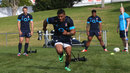 Kyle Eastmond pulls a weights sled during the England training session