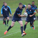 Owen Farrell passes during a training session