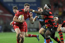 Alex Cuthbert is tackled by  Edgar Marutlulle