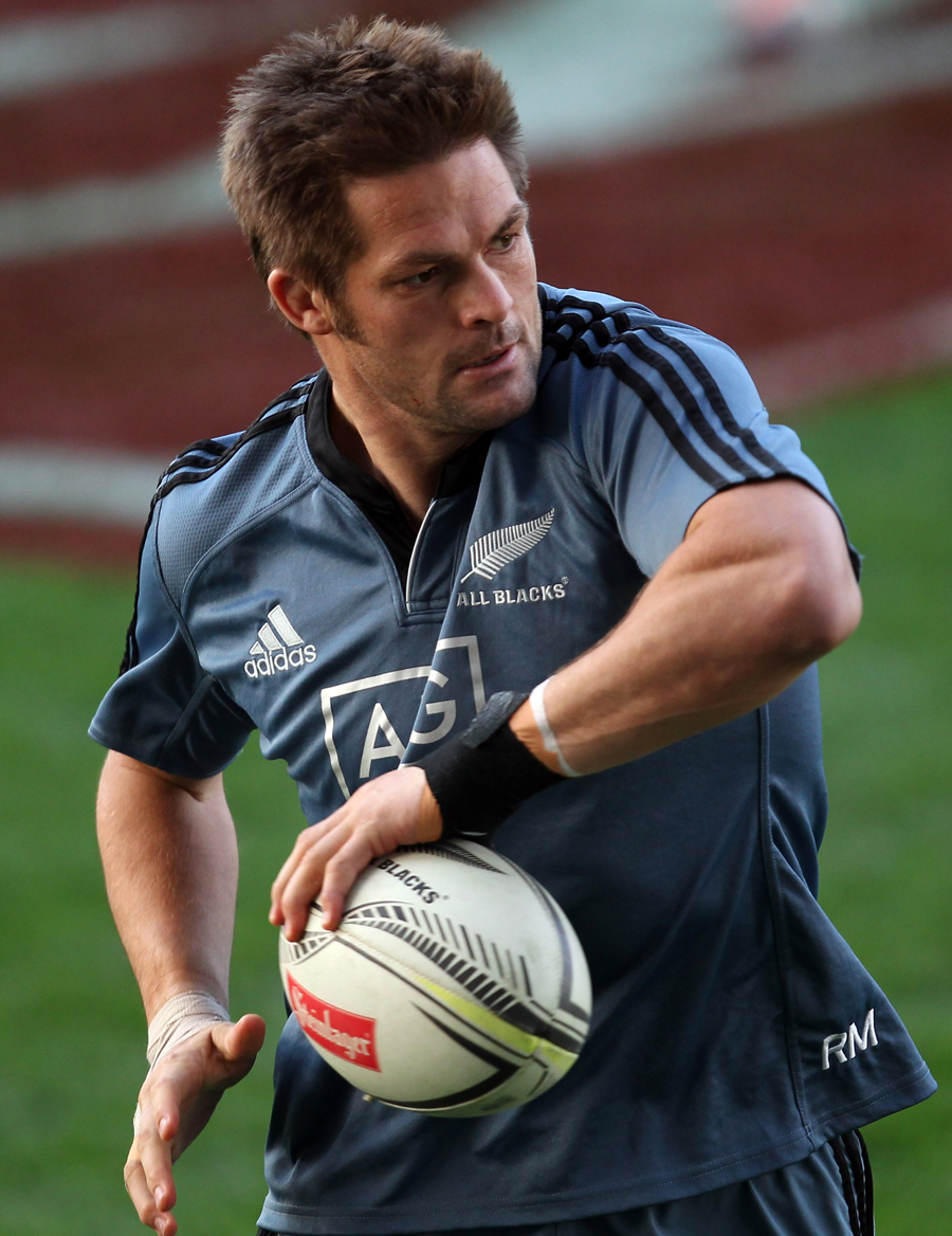 Richie McCaw passes the ball during an All Blacks training session