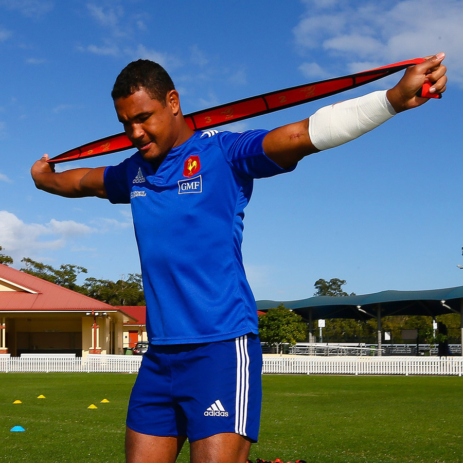 Thierry Dusautoir stretches during training