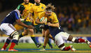 Michael Hooper tries to break the French line