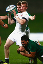 Nick Tompkins offloads under Irish pressure