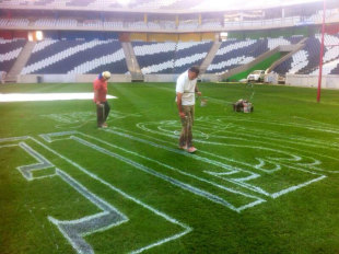 Groundstaff at the Mbombela Stadium prepare the pitch for the Test, Nelspruit, June 18, 2014