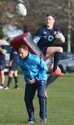 Chris Ashton catches the ball as skills coach Mike Catt holds the tackle bag, Christchurch, June 19, 2014