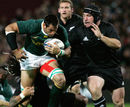 South Africa's Pierre Spies takes the game to New Zealand