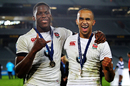 Maro Itoje and Aaron Morris of England celebrate with their winning medals