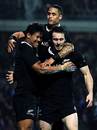New Zealand's Julian Savea is congratulated by Aaron Smith and Ben Smith 