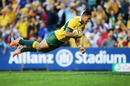 Israel Folau leaps to score a try