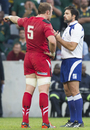 Alun Wyn Jones tries - without success - to persuade Steve Walsh not to award a penalty-try