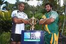 Fiji's Akapusi Qera and Cook Islands' Stanley Wright pose with the Webb Ellis Cup