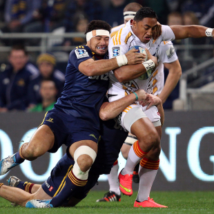 Bundee Aki attempts to burst through the tackle of Shane Christie, Highlanders v Chiefs, Super Rugby, Forsyth Barr, Hamilton, June 27, 2014