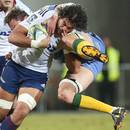 Western Force's Hugh McMeniman rides the Blues' Steven Luatua to the ground