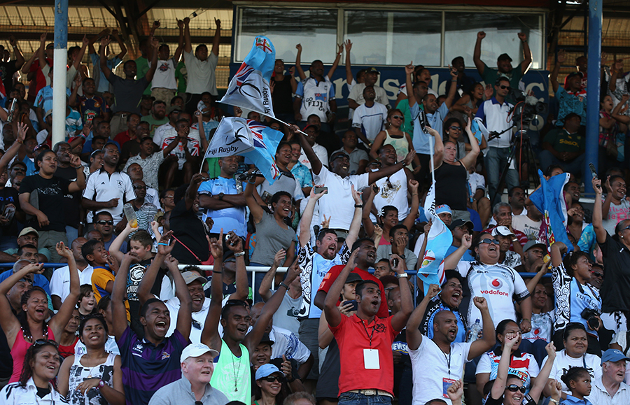 Fiji fans celebrate a try against the Cook Islands