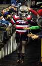 Counties Manukau's mascot Steely Dan leads the team out of the tunnel