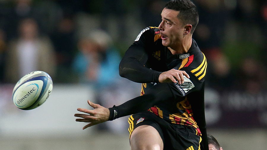 James Lowe offloads in the tackle, Chiefs v Hurricanes, Super Rugby, Waikato Stadium, July 4, 2014