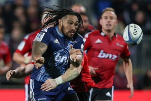The Blues' Ma'a Nonu passes the ball in a tackle, Crusaders v Blues, Super Rugby, AMI Stadium, Christchurch, July 5, 2014